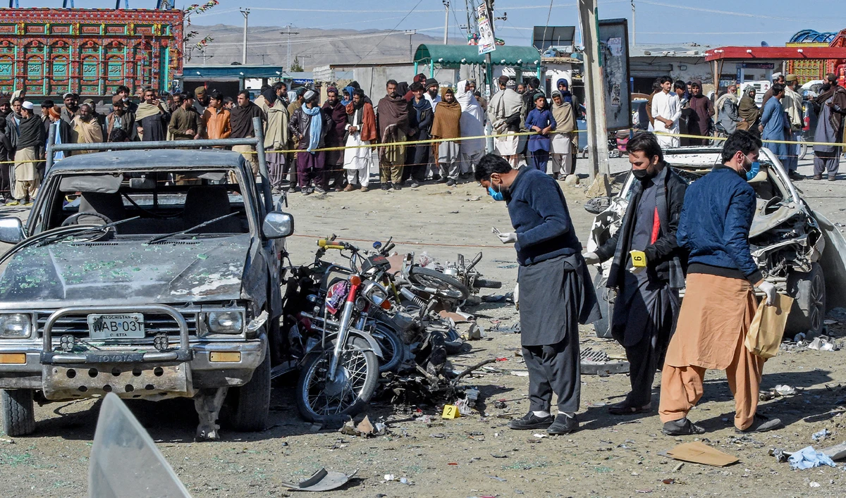Officials collect evidences at the site of a bomb blast outside the office of an independent candidate in Pishin district, around 50 kilometres (30 miles) from Quetta on February 7, 2024. (AFP/File)