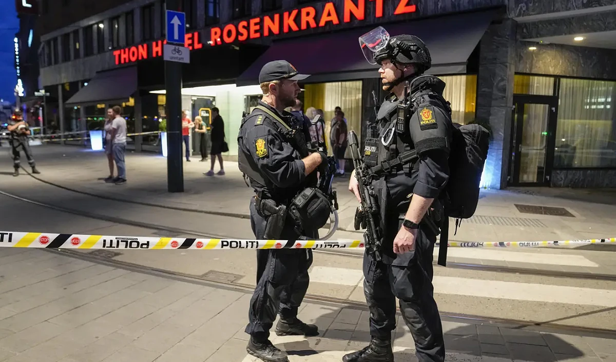 In this file photograph, taken on June 25, 2022, shows police stand guard outside a bar in central Oslo following an attack that killed 2 during a festival rally. (AP/File)