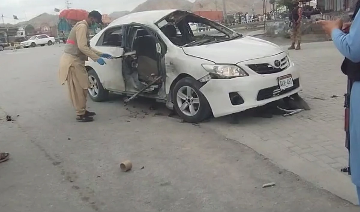 Officials examine the blast site where a senior journalist, Maulvi Muhammad Siddique Mengal, along with two other people, was killed in Kuzadar, Balochistan, on May 3, 2024. (AN photo)