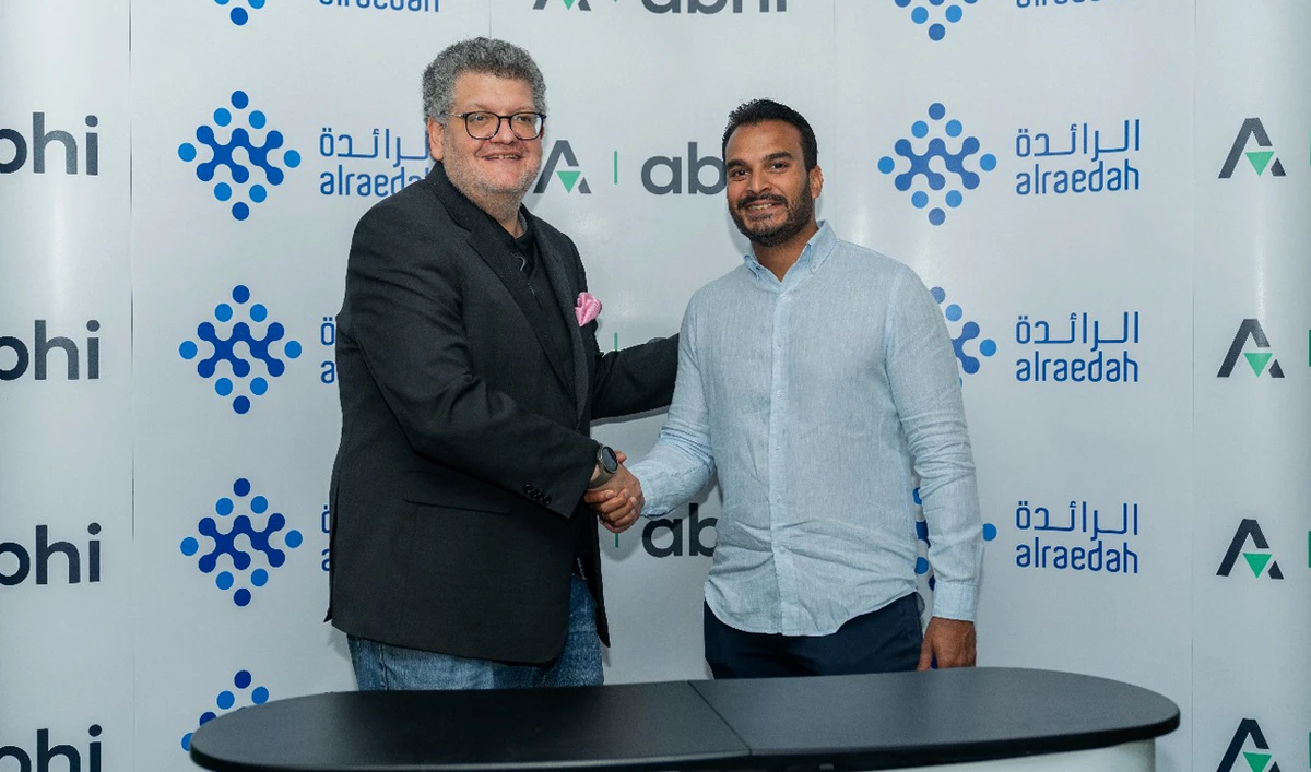 In this handout photograph, taken and released by Pakistani startup Abhi on May 9, 2024, Abhi and Alraedah Digital Solutions, a leading Saudi technology company, officials shake hands during the sigining of a partnership agreement. (Photo courtesy: Abhi)
