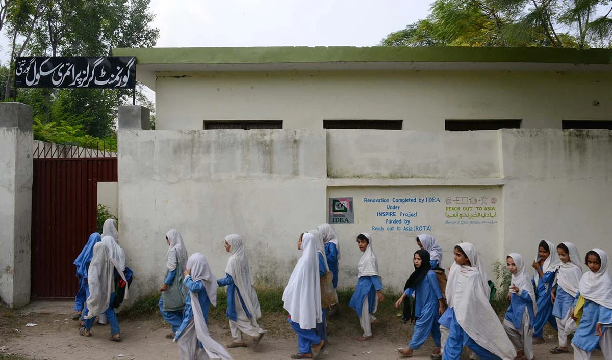 Pakistani girls arrive for class at a school in Mingora, a town in Swat valley, on October 9, 2013, the first anniversary of the shooting of Malala Yousafzai by the Taliban. (AFP/File)