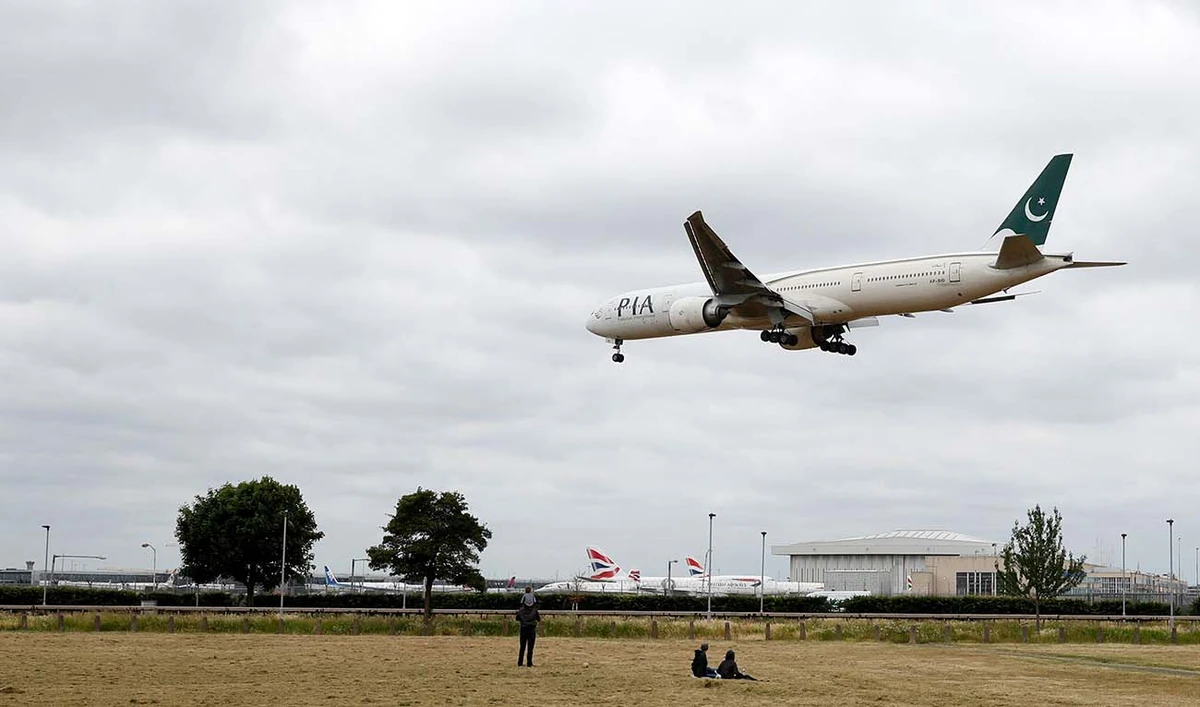 A Pakistan International Airlines Boeing 777 comes in to land at Heathrow airport in west London as the UK government's planned 14-day quarantine for international arrivals to limit the spread of Covid-19 starts on June 8, 2020. (AFP/File)