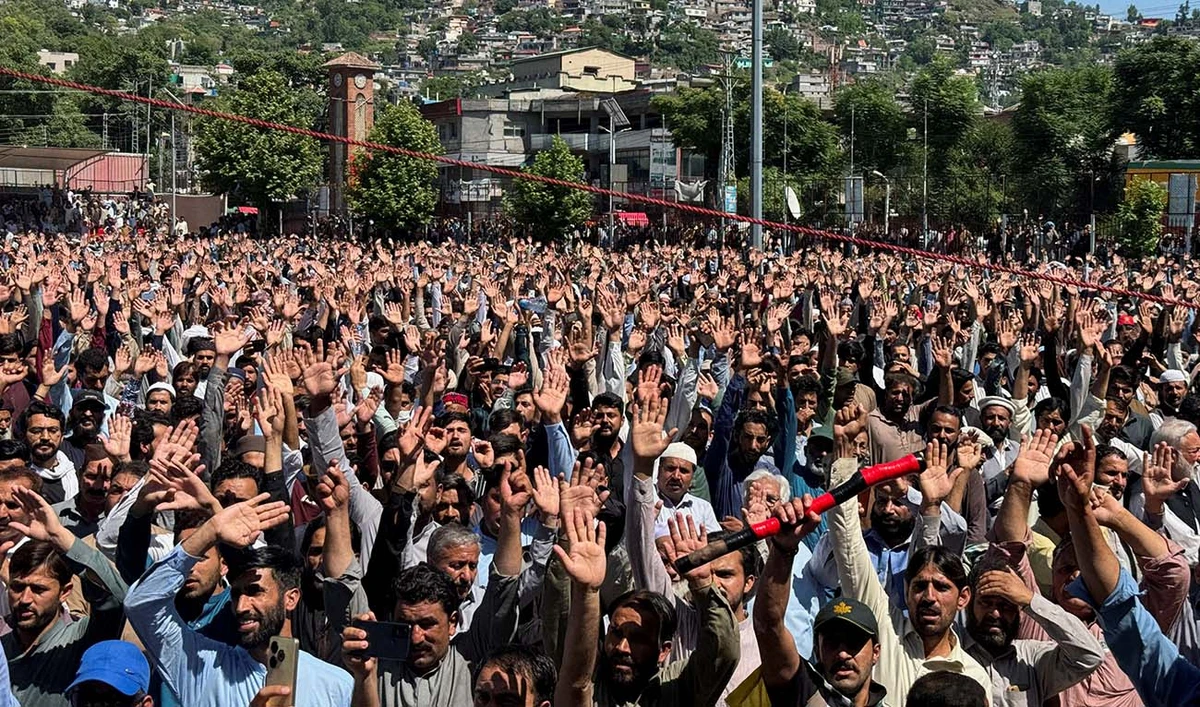 People raise their hands as they chant slogans while attending the funeral of people, who were killed during a protest by an alliance of civil rights groups, demanding the subsidy on electricity and wheat prices in the face of rising inflation, in Muzaffarabad, Pakistan-ruled Kashmir, Pakistan May 14, 2024. (REUTERS)