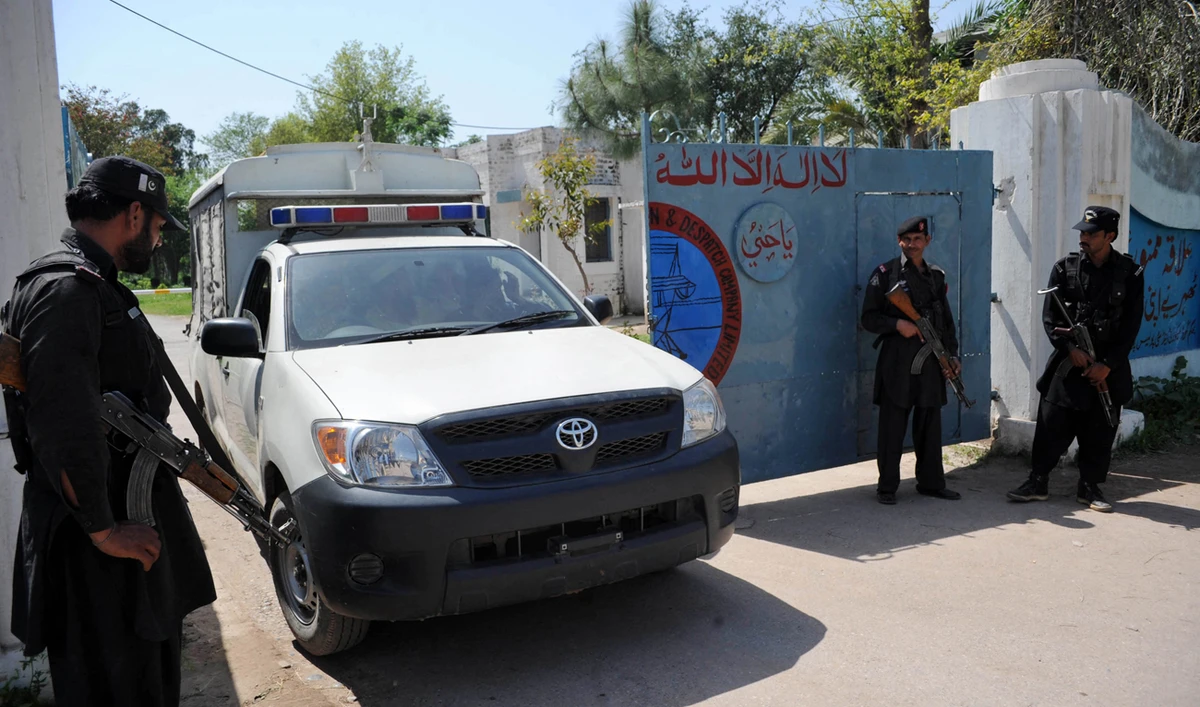 In this file photograph, taken on April 2, 2013, Pakistani security personnel stand guard outside an electricity power plant in Badh Bher, a suburb of Peshawar. (AFP/File)