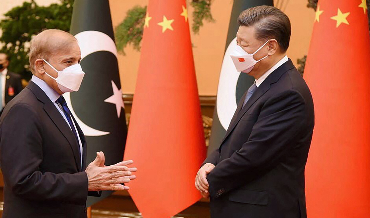 This handout picture released by the Pakistan Prime Minister Office on November 2, 2022, shows Pakistan Prime Minister Shahbaz Sharif (L) speaks with China's President Xi Jinping prior to their talks at the Great Hall of the People in Beijing, China. (AFP/File)