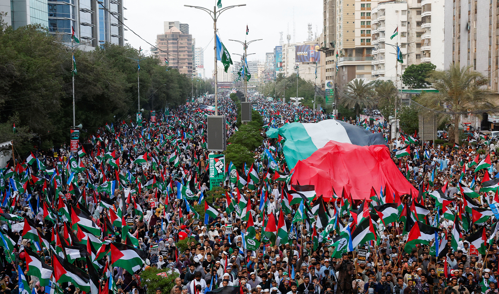 People wave Palestinian flags during Gaza Million March in solidarity with Palestinians, organized by the religious and political party Jamaat-e-Islami (JI) in Karachi, Pakistan on June 2, 2024. (REUTERS)