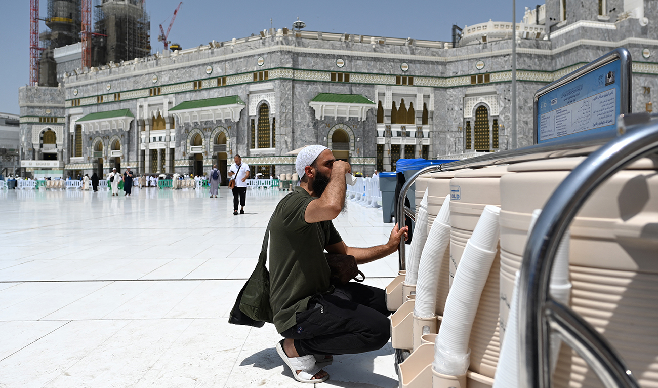 A pilgrim drinks Zamzam water at the Grand Mosque in the holy city of Mecca on June 25, 2023, during the annual Hajj pilgrimage. (AFP/File)