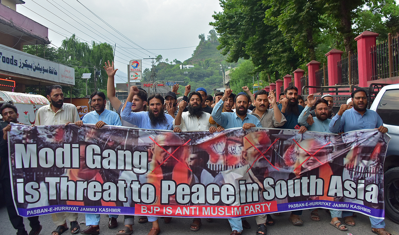 Activists of Pasban-e-Hurriyat, a Kashmiri refugee organisation, chant slogans as they protest against Indian Prime Minister Narendra Modi, in Muzaffarabad in Pakistan-occupied Kashmir on June 4, 2024. (AFP/File)
