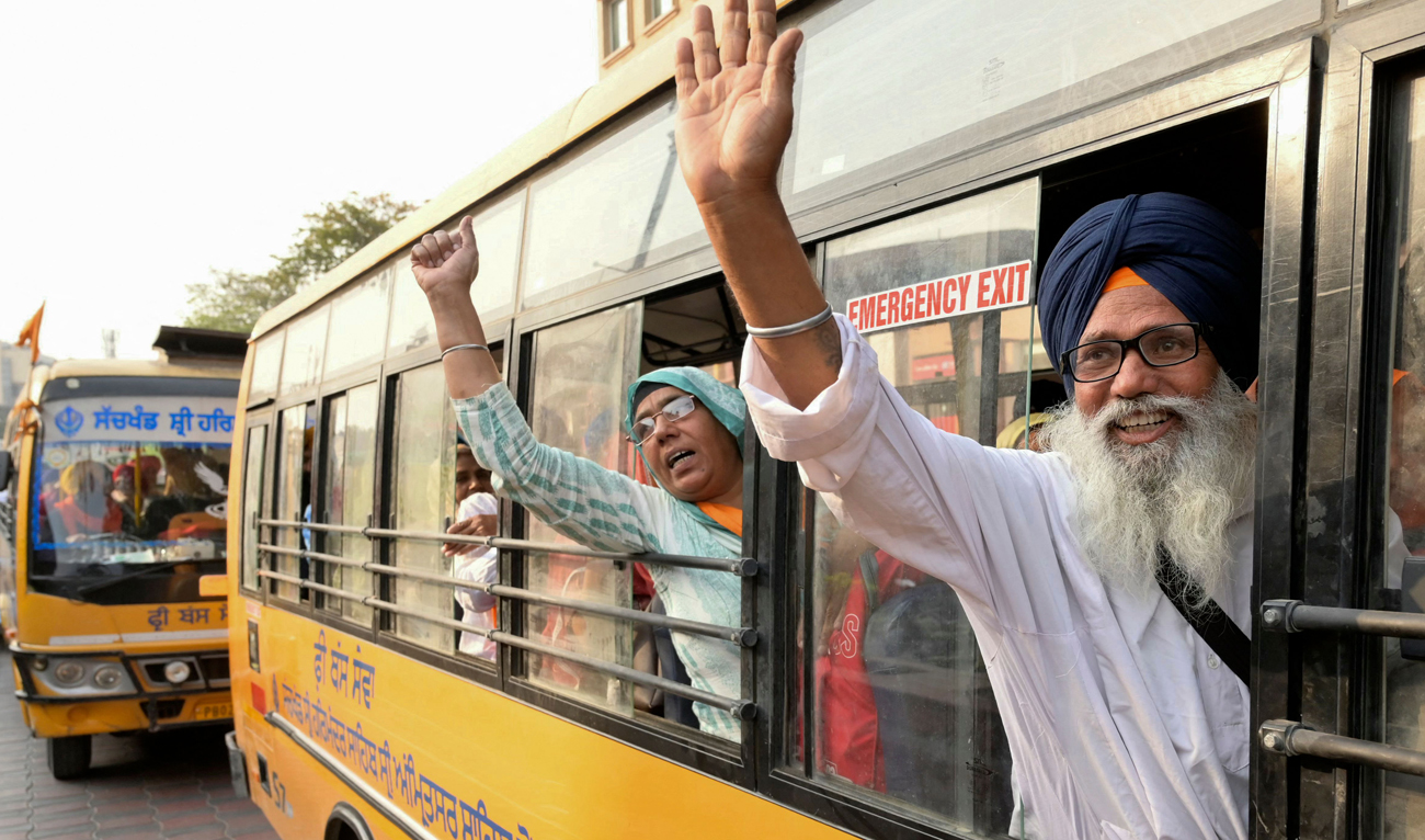 Sikh pilgrims chant slogans before leaving for Pakistan to celebrate ‘Baisakhi’, a spring harvest festival, in Amritsar on April 13, 2024. (AFP)