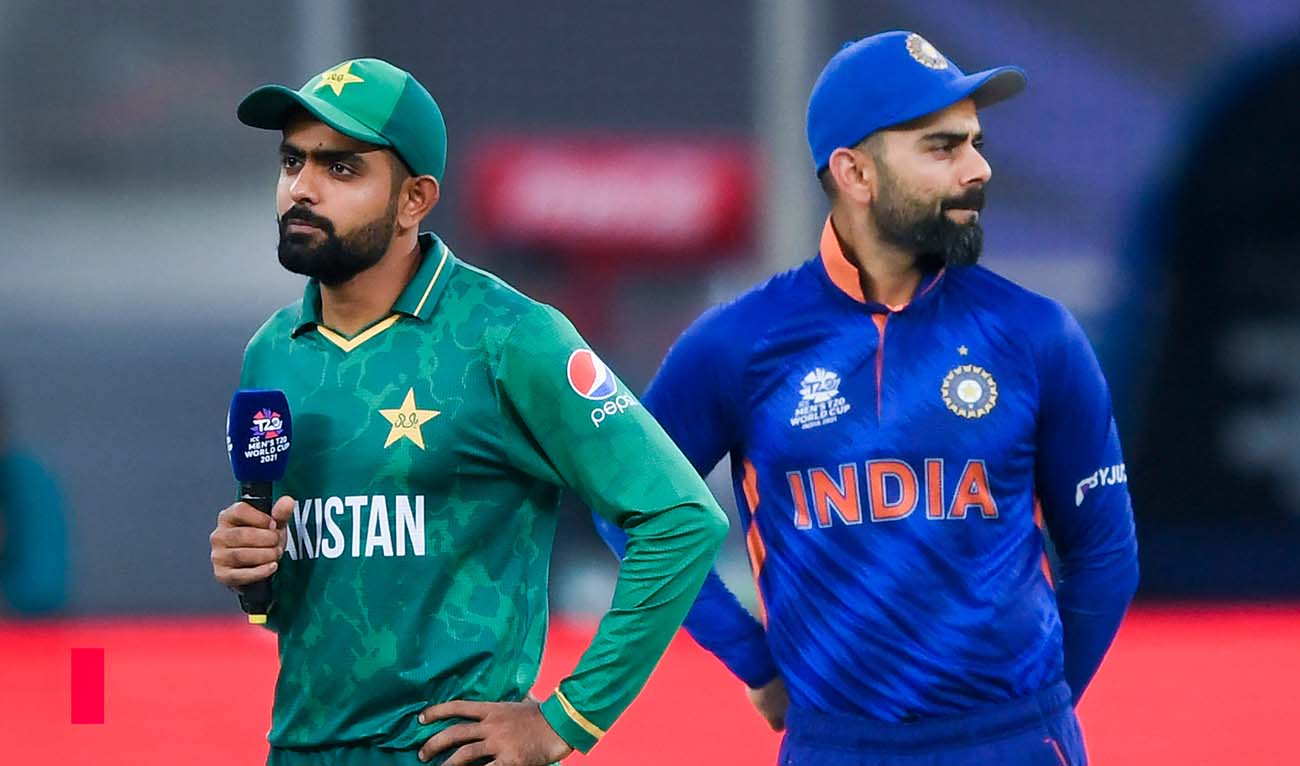 India's captain Virat Kohli (R) and his Pakistan's counterpart Babar Azam arrive on the field for the toss before the start of the ICC men’s Twenty20 World Cup cricket match between India and Pakistan at the Dubai International Cricket Stadium in Dubai on October 24, 2021. (AFP/File)