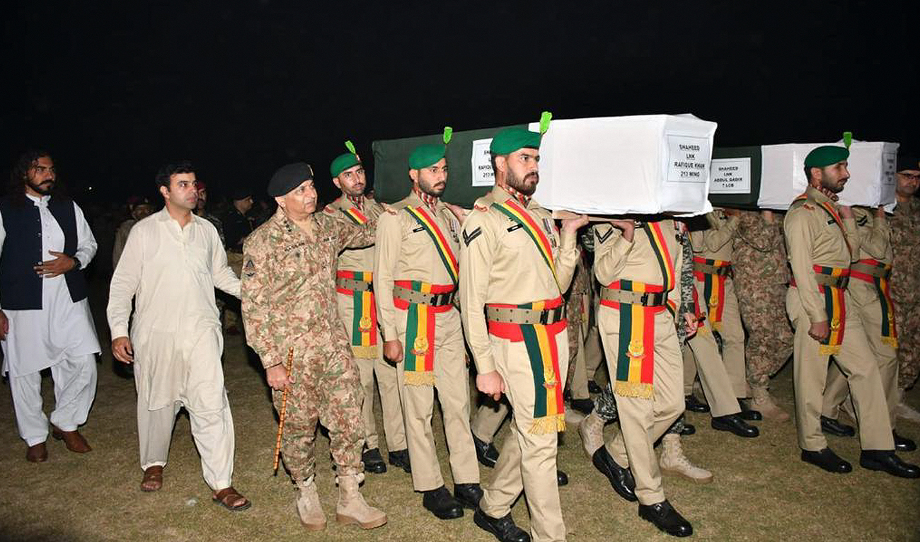 In this file photo, taken and released by Pakistan’s Inter-Service Public Relations (ISPR), military personnel carry the coffin of security officials who were killed during an intelligence-based operation in Tirah Valley of Khyber district on November 6, 2023. (Photo courtesy: ISPR/File)