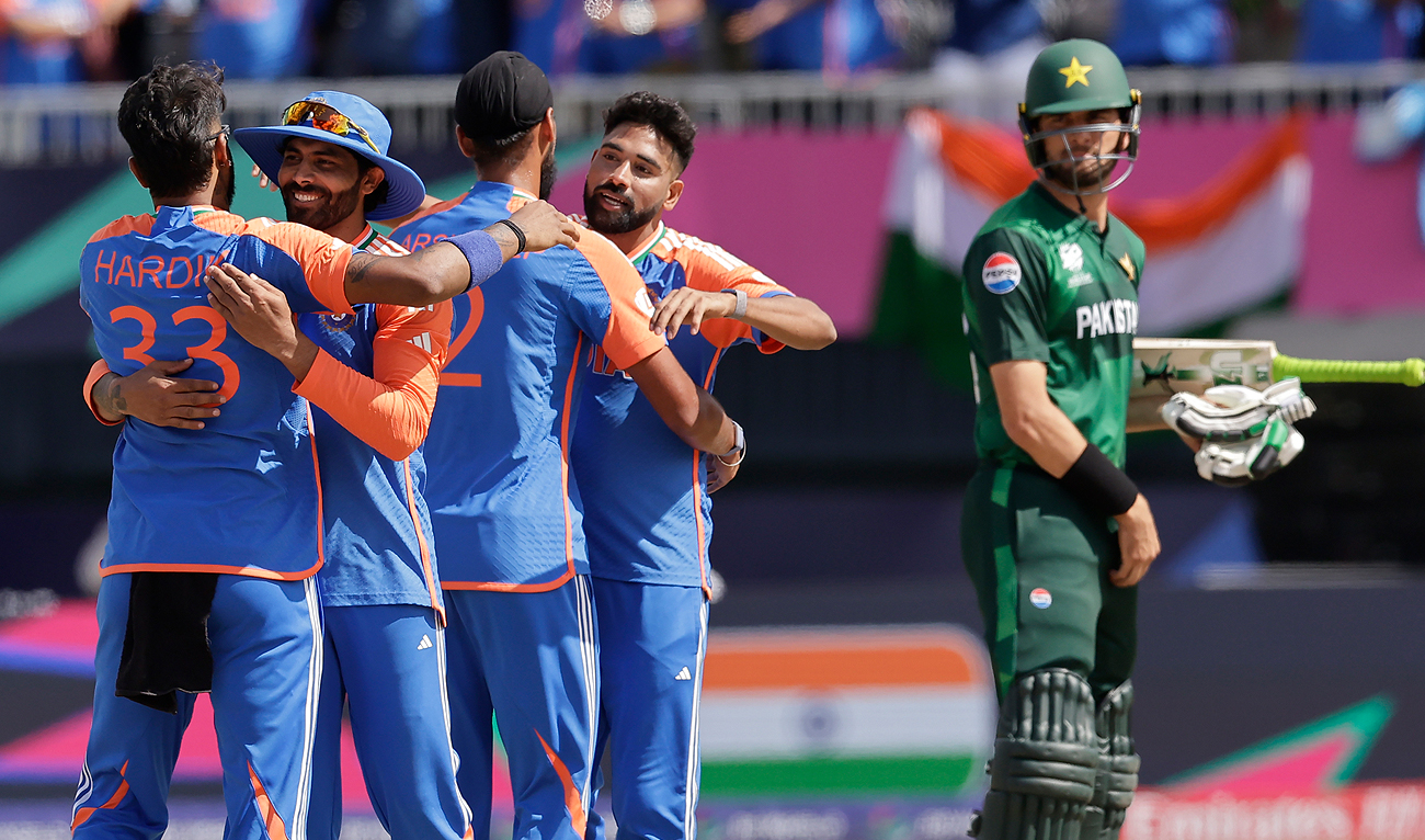 Pakistan’s Shaheen Shah Afridi, right, watches as Indian players celebrate their win in the ICC Men’s T20 World Cup cricket match between India and Pakistan at the Nassau County International Cricket Stadium in Westbury, New York on June 9, 2024. (AP)