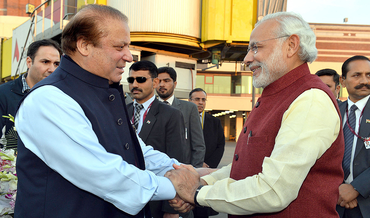 In this file photograph released by the Press Information Bureau (PIB) on December 25, 2015, Indian Prime Minister, Narendra Modi (R) shakes hands with Pakistan’s the-then Prime Minister, Nawaz Sharif in Lahore. (AFP/File)