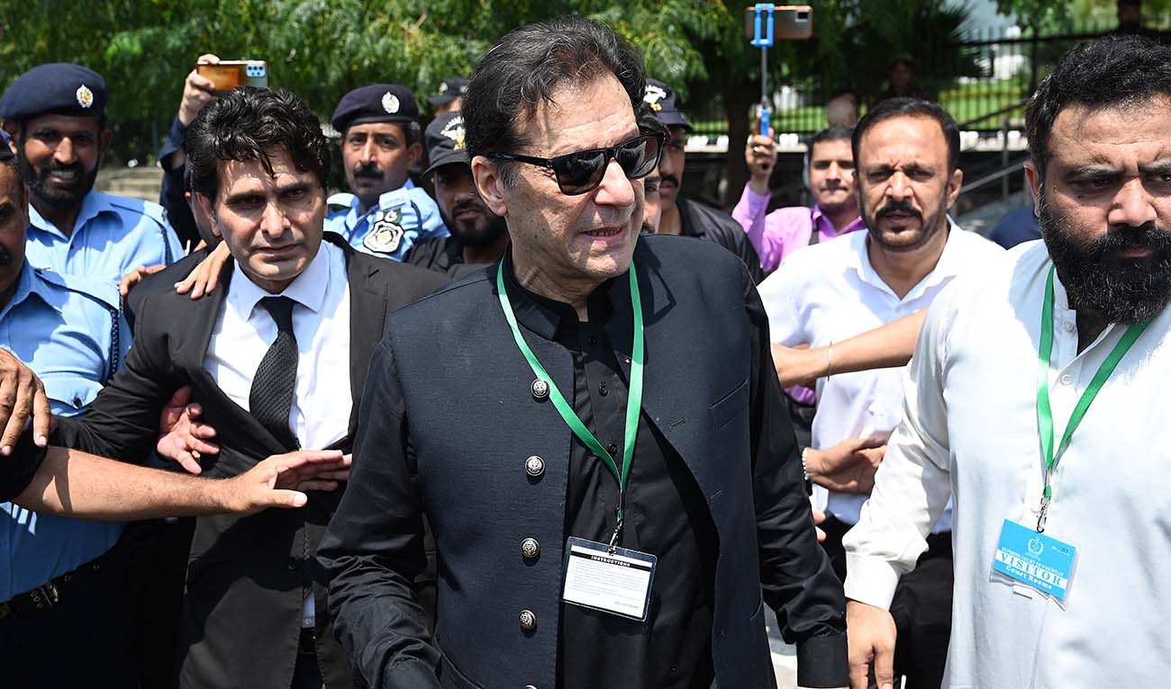 Pakistan’s former Prime Minister Imran Khan (C) leaves after appearing in the Supreme Court in Islamabad on July 24, 2023. (AFP/File)