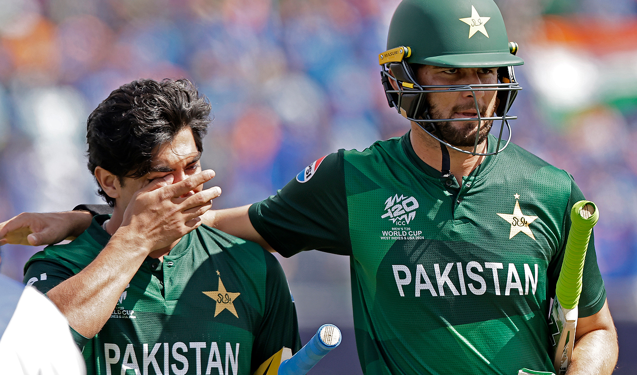 Pakistan’s Shaheen Shah Afridi, right, consoles batting partner Naseem Shah as they leave the field after their loss in the ICC Men’s T20 World Cup cricket match between India and Pakistan at the Nassau County International Cricket Stadium in Westbury, New York, Sunday, June 9, 2024. (AP)