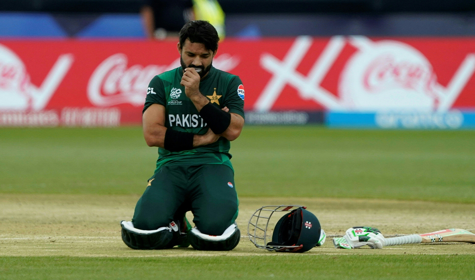 Pakistan's Muhammad Rizwan kneels down as the team takes a break during the ICC men's Twenty20 World Cup 2024 group A cricket match between Pakistan and Canada at Nassau County International Cricket Stadium in East Meadow, New York on June 11, 2024. (AFP/File)