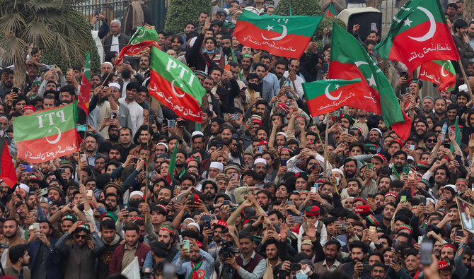Supporters of former Prime Minister Imran Khan's party, the Pakistan Tehreek-e-Insaf (PTI), wave flags as they protest demanding free and fair results of the elections, in Peshawar on February 17, 2024. (REUTERS)