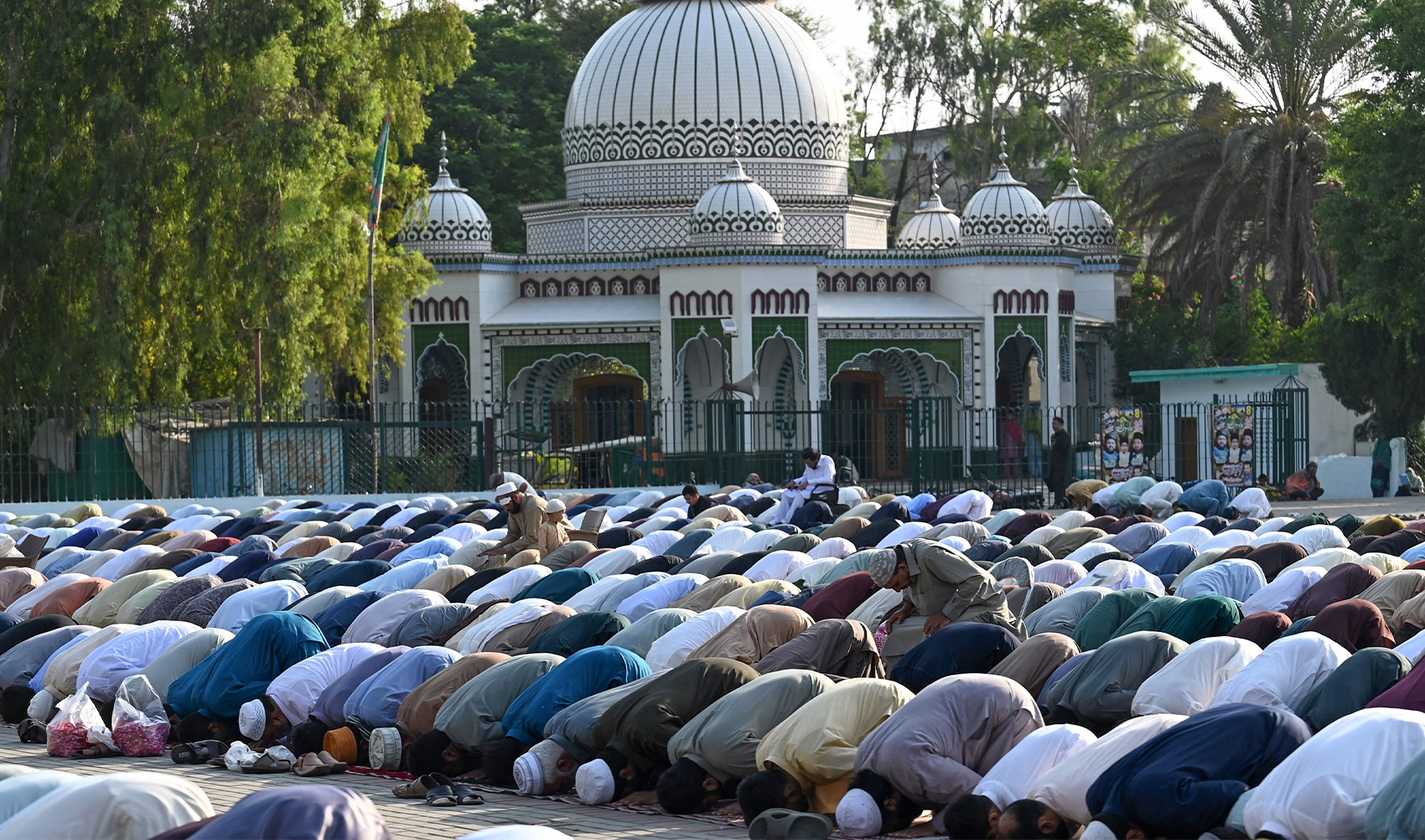 Muslim devotees offer Eid al-Adha prayers at the Eidgah ground in Rawalpindi on June 17, 2024. (AFP)