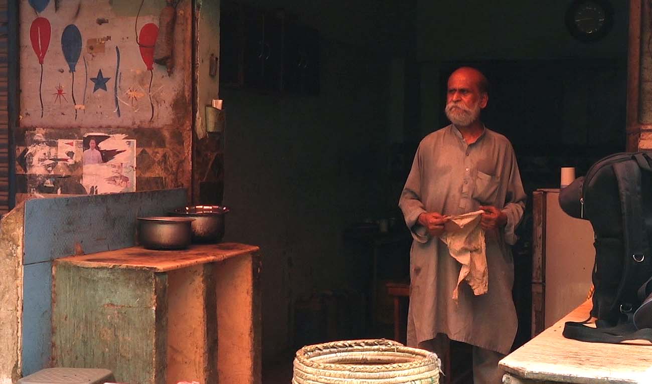 The still image taken from a video recorded on June 12. 2024, shows Wajid Farid standing outside his shop in Karachi, Pakistan. (Photo courtesy: AN Photo)