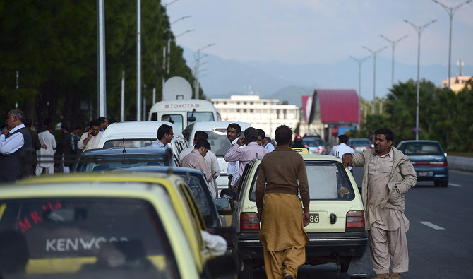 In this file photo taken on October 26, 2015, people gather outside the buildings after earthquake tremors felt in Islamabad. (AFP/File)