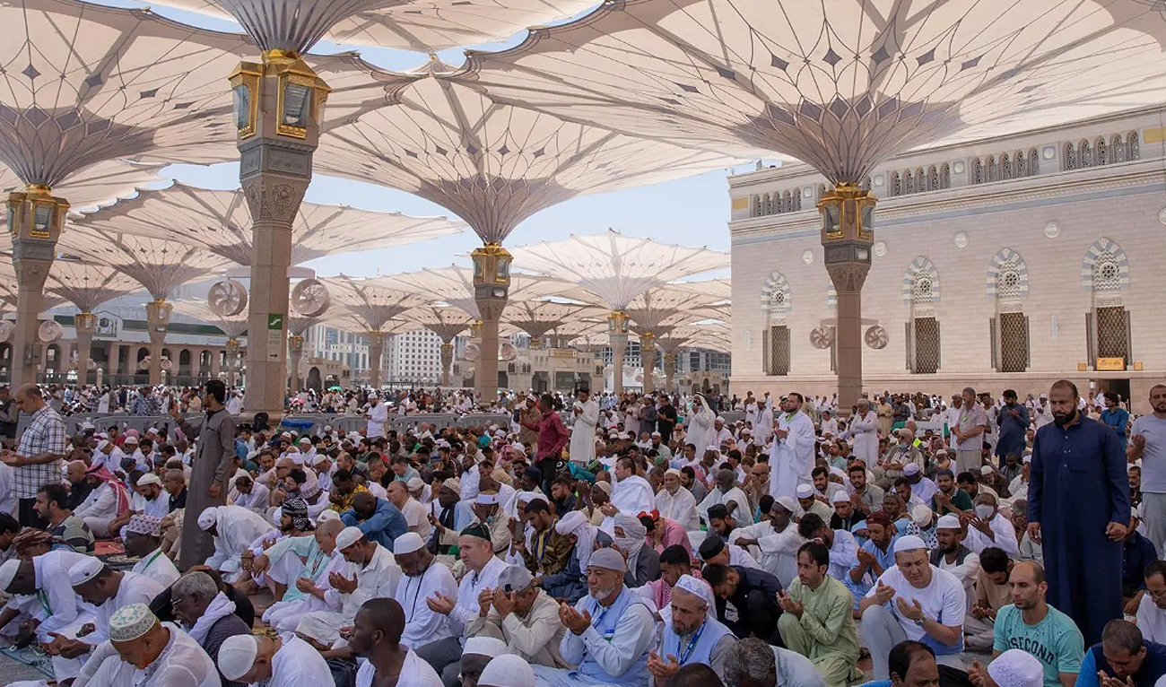 In this handout photograph, taken and released by the Saudi Press Agency on June 19, 2024, Hajj pilgrims offer prayers at the Prophet’s Mosque in Madinah as pilgrims start departing to their respective countries after performing annual pilgrimage in Makkah. (SPA)