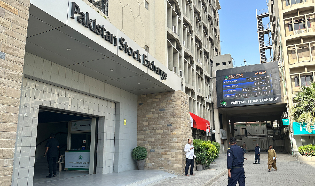People walk outside the Pakistan Stock Exchange building in Karachi on May 21, 2024. (AN Photo)