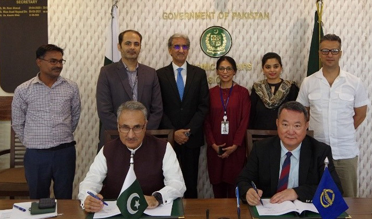 In this handout photograph, taken and released by Asian Development Bank on June 21, 2024, ADB Country Director Yong Ye (right) and Pakistan’s Secretary Economic Affairs Division Kazim Niaz (left) sign the agreement for $250 million policy-based loan in Islamabad. (Photo courtesy: Facebook/ADB Pakistan)