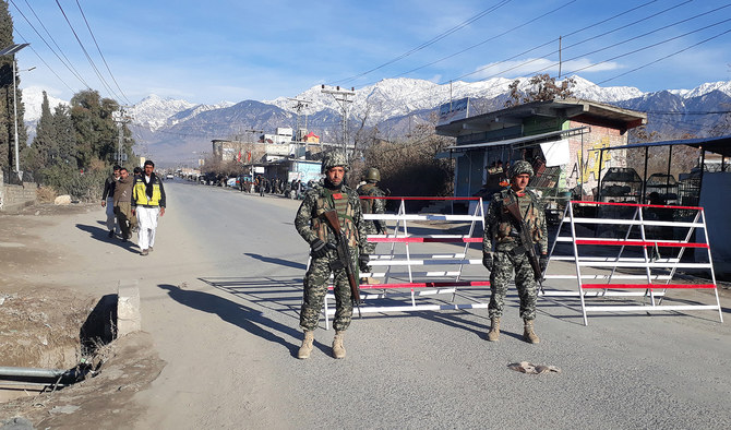 In this file photo, taken on January 22, 2017, Pakistani soldiers stand guard at a checkpoint in Parachinar, capital of the Kurram tribal district. (AFP/File)