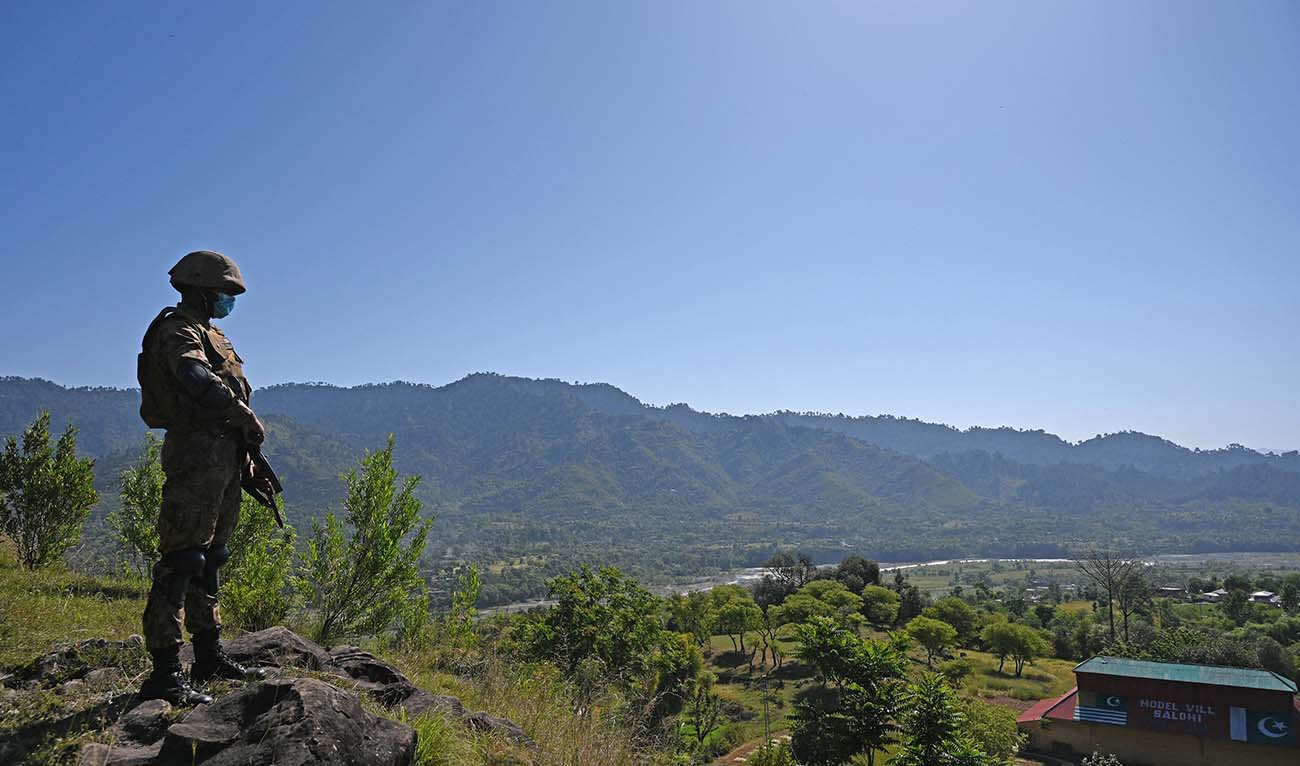 A Pakistani soldier stands guard near the Line of Control, de facto border between India and Pakistan at Salohi village in Poonch district of Pakistan-administered Kashmir on April 26, 2021. (AFP/File)
