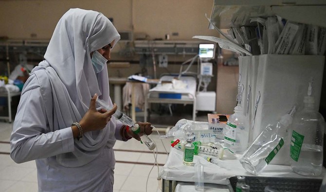 A nurse prepares a vaccine to treat a child suffering from pneumonia at the Children's Hospital in Lahore on January 31, 2024. (AFP/File)