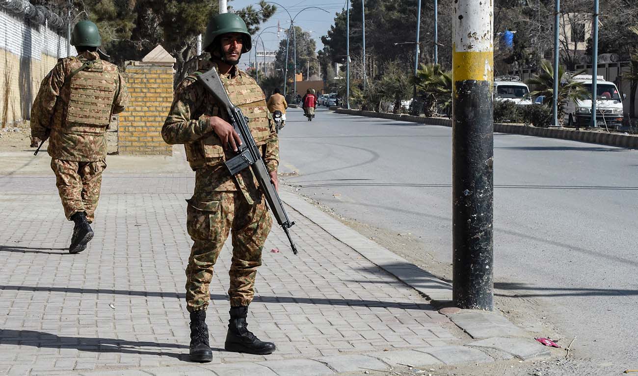 Pakistani army personnel stand guard along a road in Quetta on February 7, 2024, a day prior Pakistan's national elections. (AFP/File)