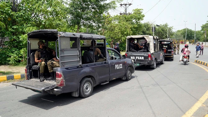 In this photo, taken on May 18, 2023, police officers patrol around streets in Lahore, Pakistan. (AP/File)