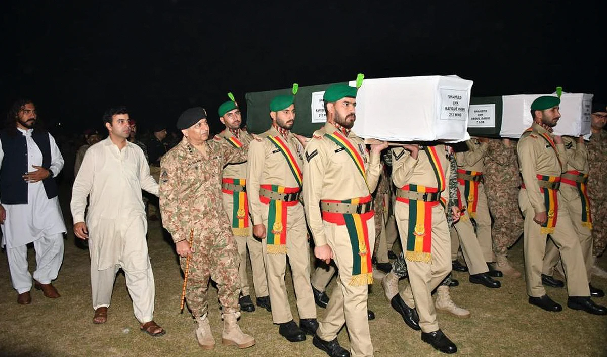 In this file photo, taken and released by Pakistan’s Inter-Service Public Relations (ISPR), military personnel carry the coffin of security officials who were killed during an intelligence-based operation in Tirah Valley of Khyber district on November 6, 2023. (Photo courtesy: ISPR/File)