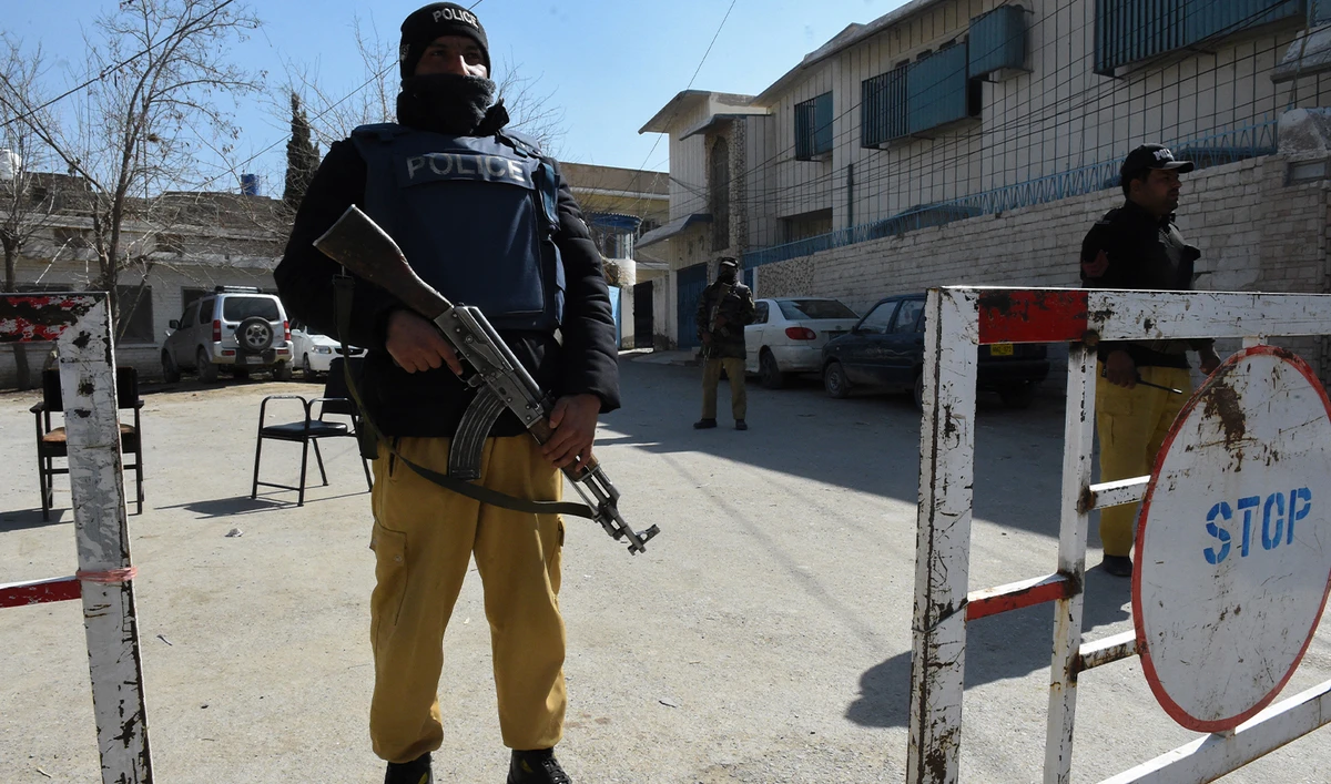 Policemen stand guard outside a building in Quetta on February 5, 2024. (AFP/File)