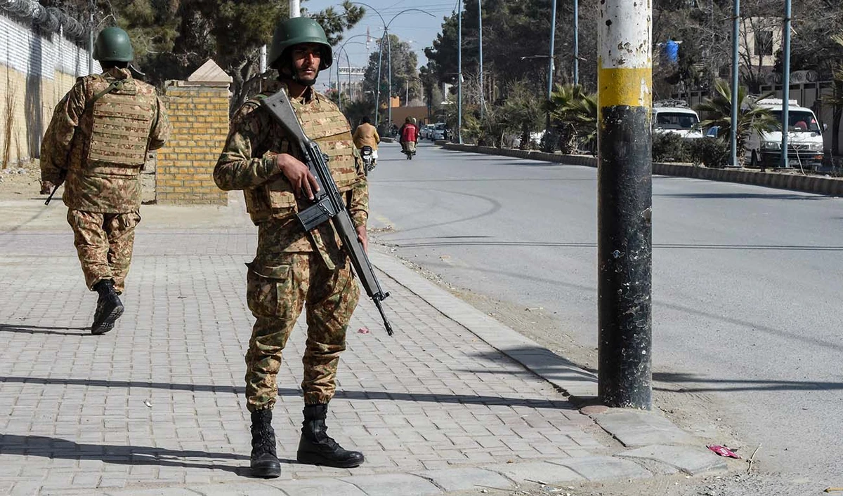 Pakistani army personnel stand guard along a road in Quetta on February 7, 2024, a day prior Pakistan's national elections. (AFP/File)