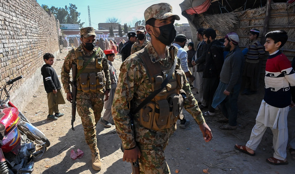 Pakistani army personnel patrol outside a polling station during Pakistan's national elections in Peshawar on February 8, 2024. (AFP/File)