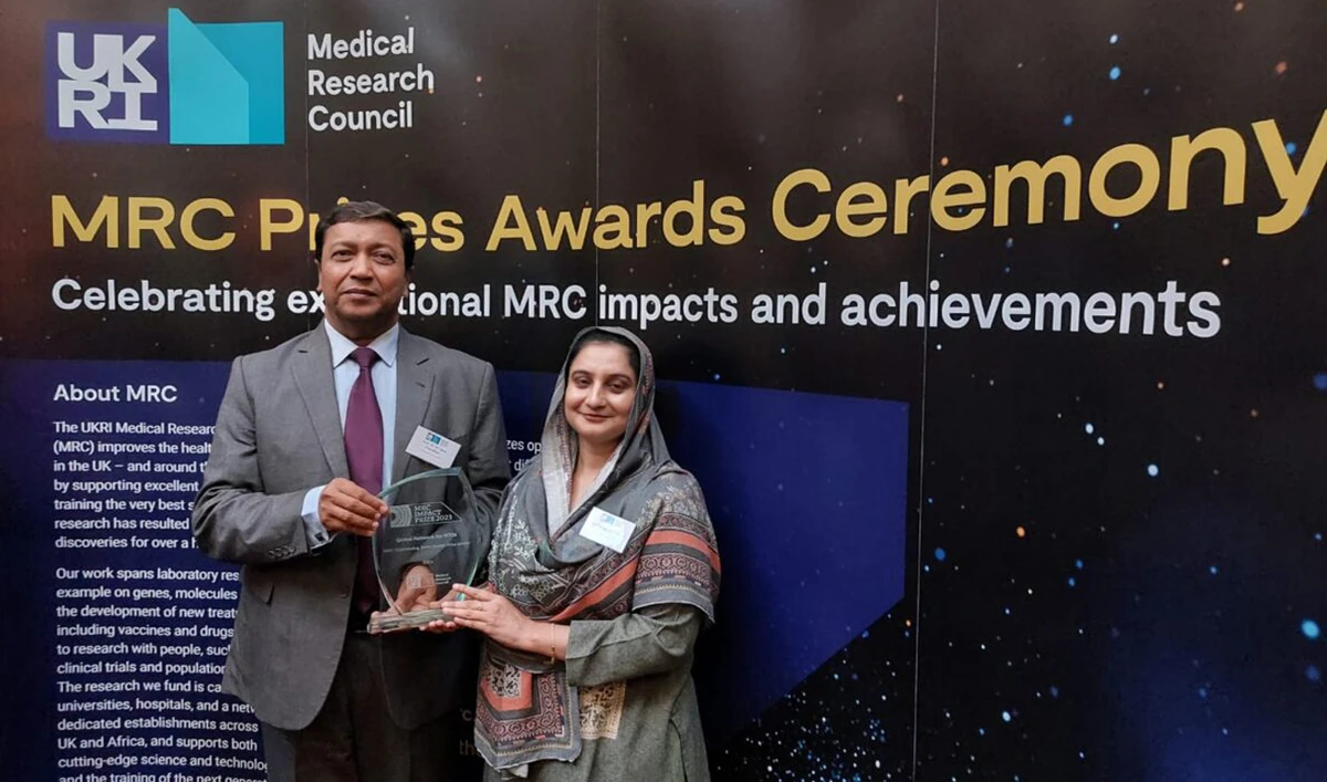 In this photograph, released by the Associated Press of Pakistan on June 30, 2024, Prof Dr M Iqbal Choudhary (left) and Prof Dr Sammer Yousuf gesture for a photo after they receive “Outstanding Team Impact Prize” from UK’s Medical Research Council. (APP)
