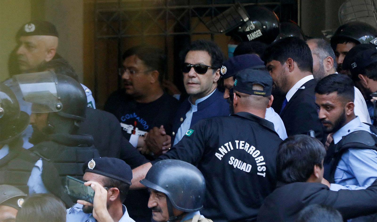 Security officers escort Pakistan's former Prime Minister Imran Khan, as he appeared in Islamabad High Court, Islamabad, Pakistan on May 12, 2023. (REUTERS/File)