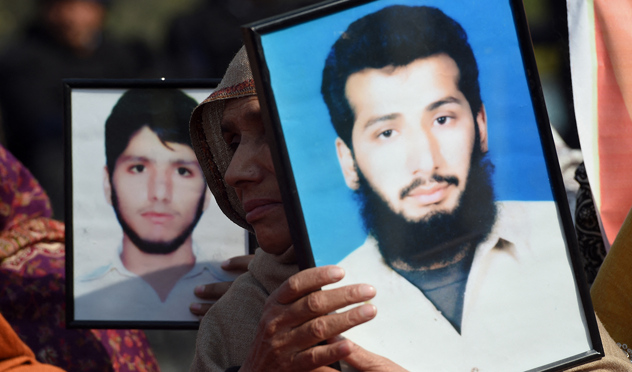 Pakistani human rights activists and families of missing persons hold photographs of those missing at a protest on the Human Rights Day in Islamabad on December 10, 2014. (AFP/File)