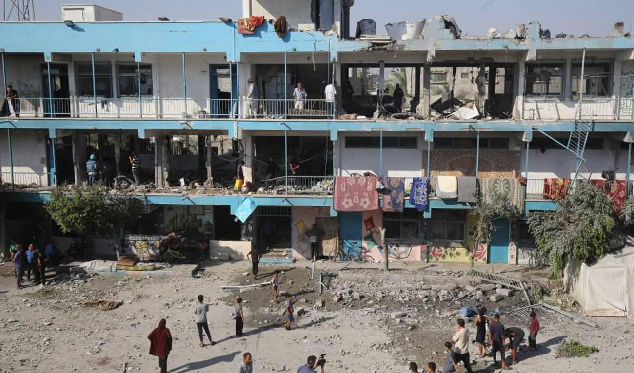 Palestinians inspect a damaged UNRWA school following an Israeli airstrike on a the displacement shelter in Nuseirat Refugee camp on June 06, 2024. (APA/File)