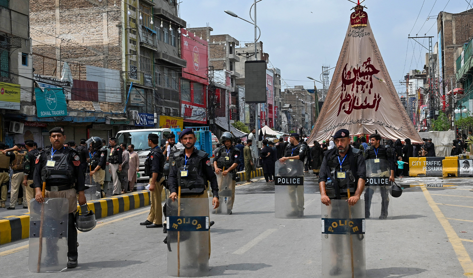 Security personnel patrol a street during a procession on the ninth day of Ashura in the Islamic month of Muharram in Peshawar on July 28, 2023, commemorating the seventh century killing of Prophet Muhammad's (PBUH) grandson Imam Hussein. (AFP/File)