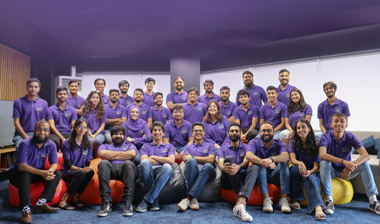 This handout photo, taken and released by the Pakistan e-commerce startup DealCart on July 4, 2024, shows company employees pose for a group photo in Karachi. (Photo courtesy: DealCart)