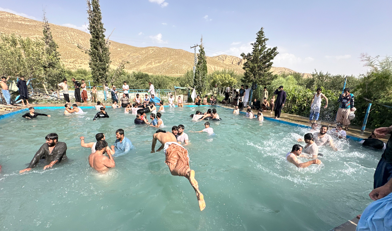 People cool off at a swimming pool during a hot summer day in Quetta on July 5, 2024. (AN Photo)