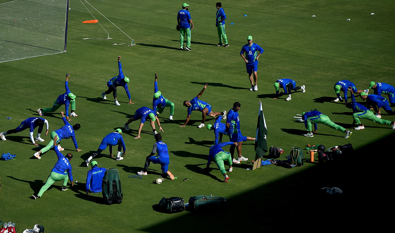 Pakistan's cricketers warm up before the team practice session at the National Stadium in Karachi on December 15, 2022, ahead of the third cricket Test match between Pakistan and England. (AFP/File)
