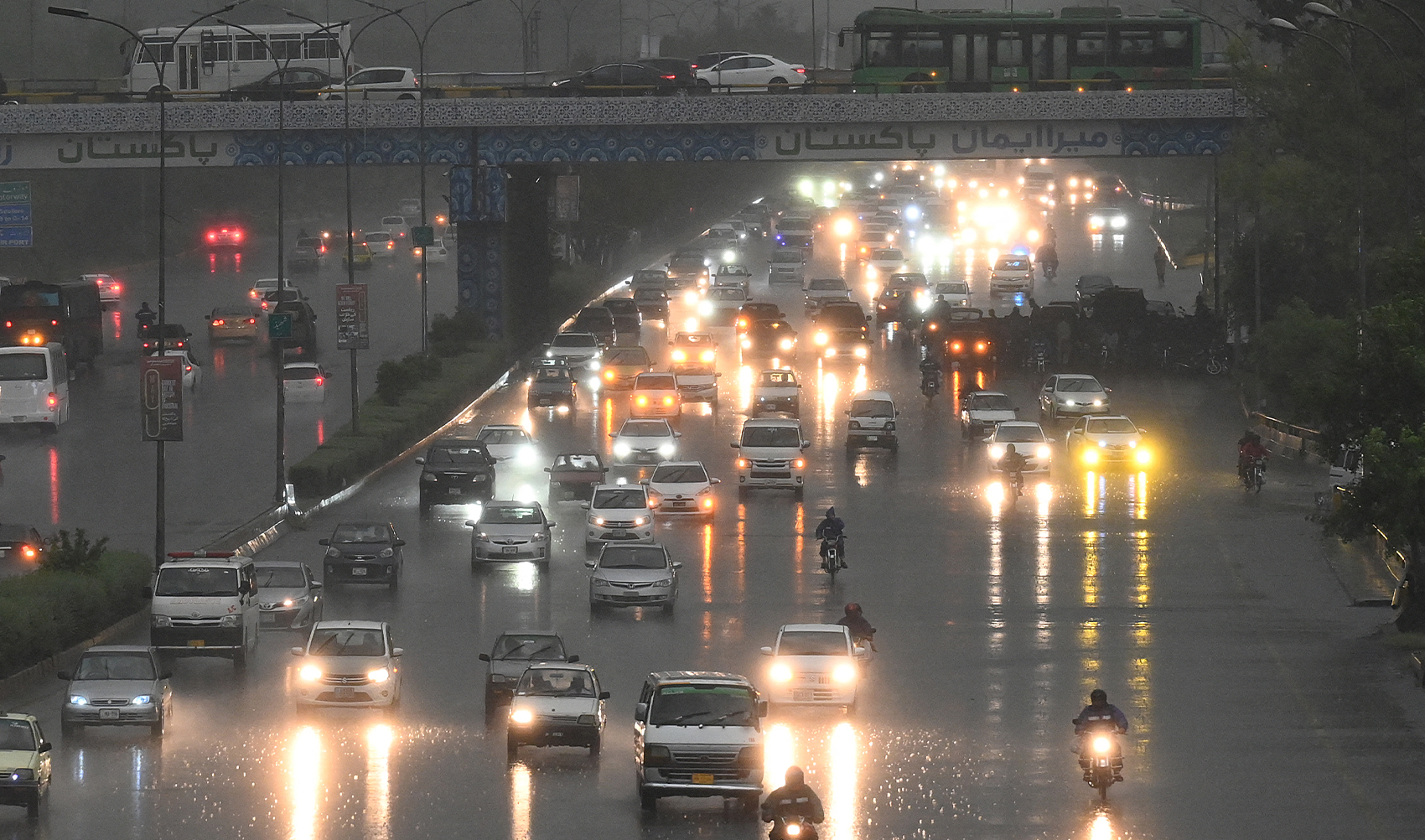 Commuters drive along a busy road during a heavy rainfall in Islamabad on May 10, 2024. (AFP/File)