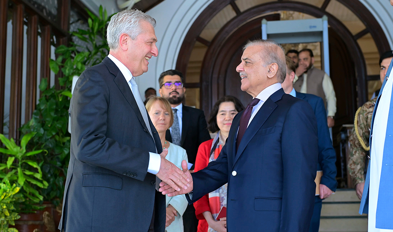 In this photo released by Pakistan’s Prime Minister Office, the UN High Commissioner for Refugees, Filippo Grandi, left, shakes hand with Pakistan’s Prime Minister Shehbaz Sharif after their meeting in Islamabad on July 9, 2024. (Prime Minister Office via AP)