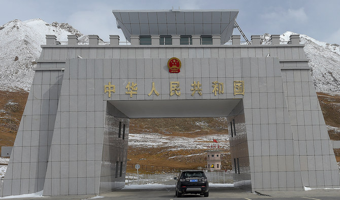 In this photograph taken on September 29, 2015, a car carrying Chinese nationals crosses at the Pak-China Khunjerab Pass, the world's highest paved border crossing at 4,600 metres above sea level. (Photo courtesy: AFP/File)