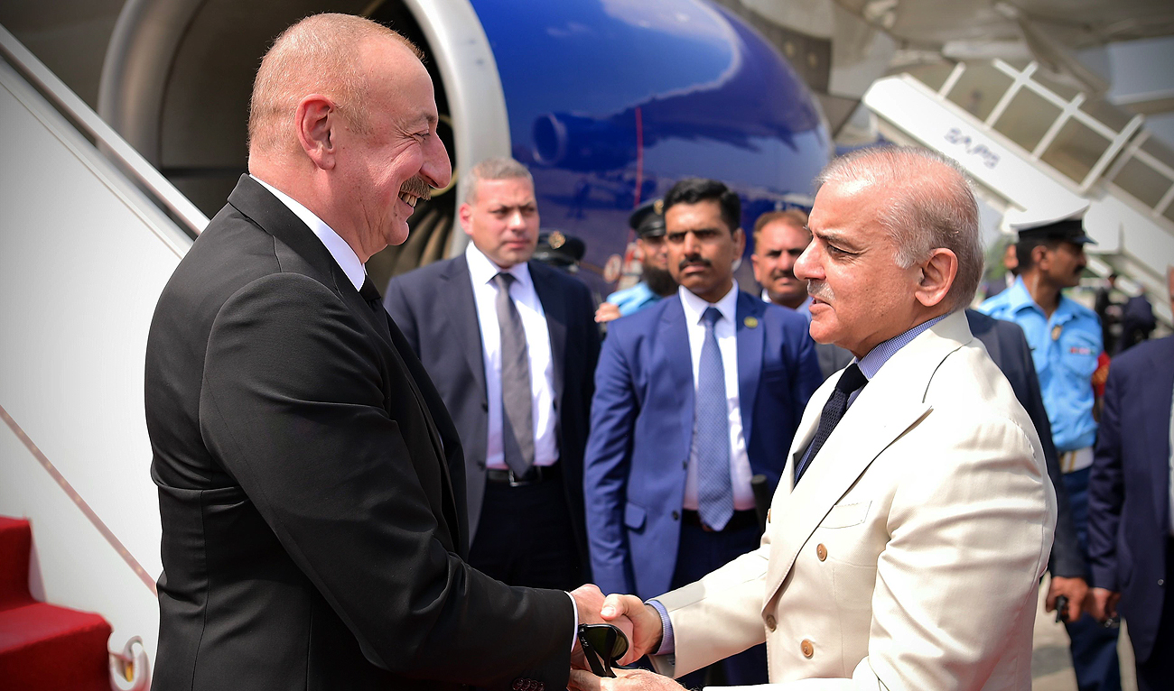 In this handout photograph, taken and released by Prime Minister’s Office, Pakistan Prime Minister Shehbaz Sharif (right) shakes hands with Azerbaijan President Ilham Aliyev (left) as he arrives in Pakistan on a two-day trip in Islamabad on July 11, 2024. (Photo courtesy: PMO)
