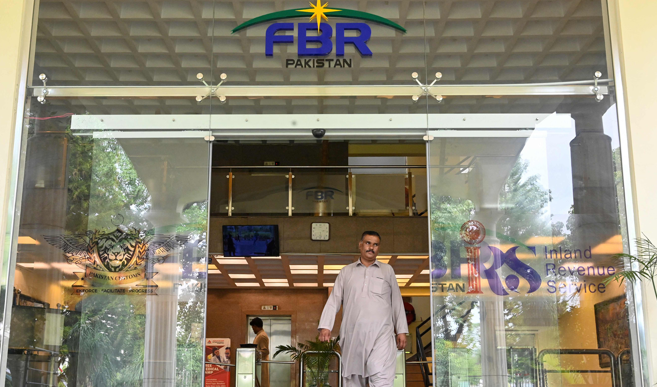 A man walks out of the Federal Board of Revenue (FBR) office in Islamabad on July 4, 2024. (AFP)