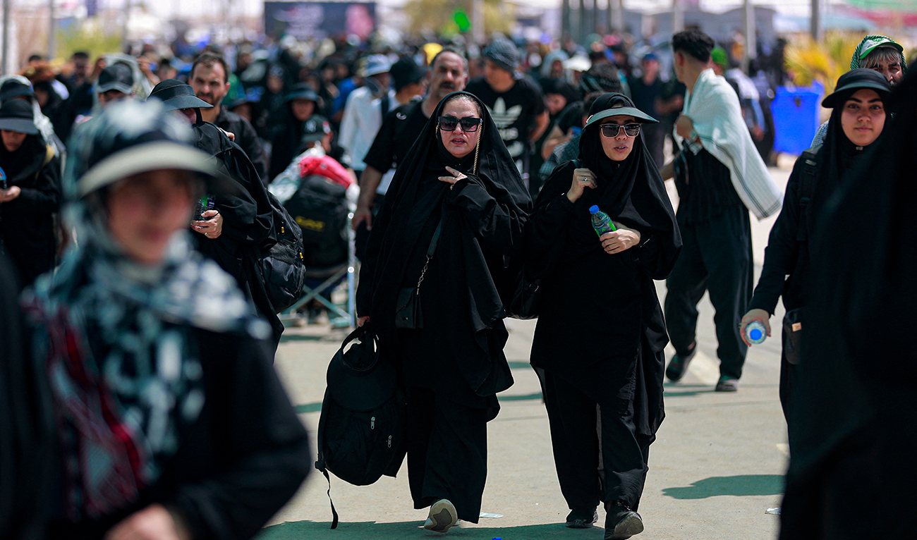 Iranian Shiite Muslim pilgrims arrive at the Zurbatiyah border crossing between Iran and Iraq on August 28, 2023. (AFP/File)
